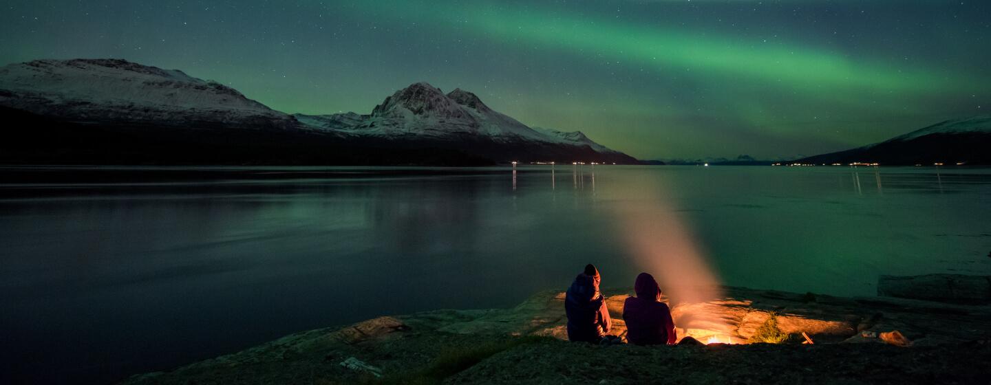 Northern lights by a beach in the Tromso region