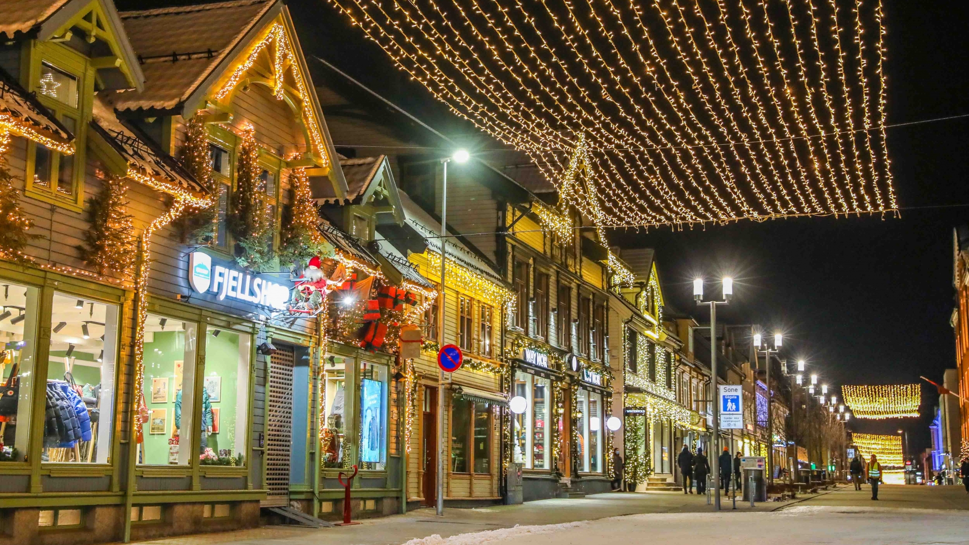 Storgata the main street in Tromsø lit for Christmas