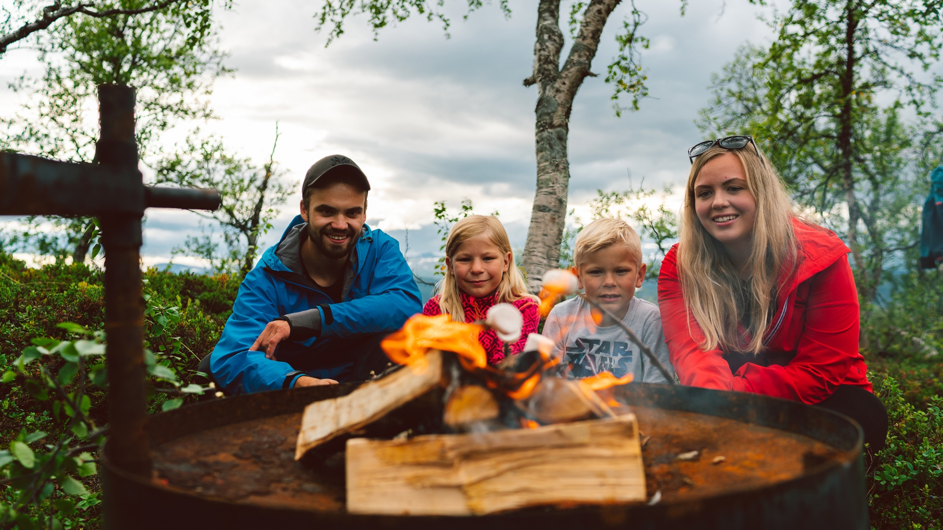 Family in front of bonfire