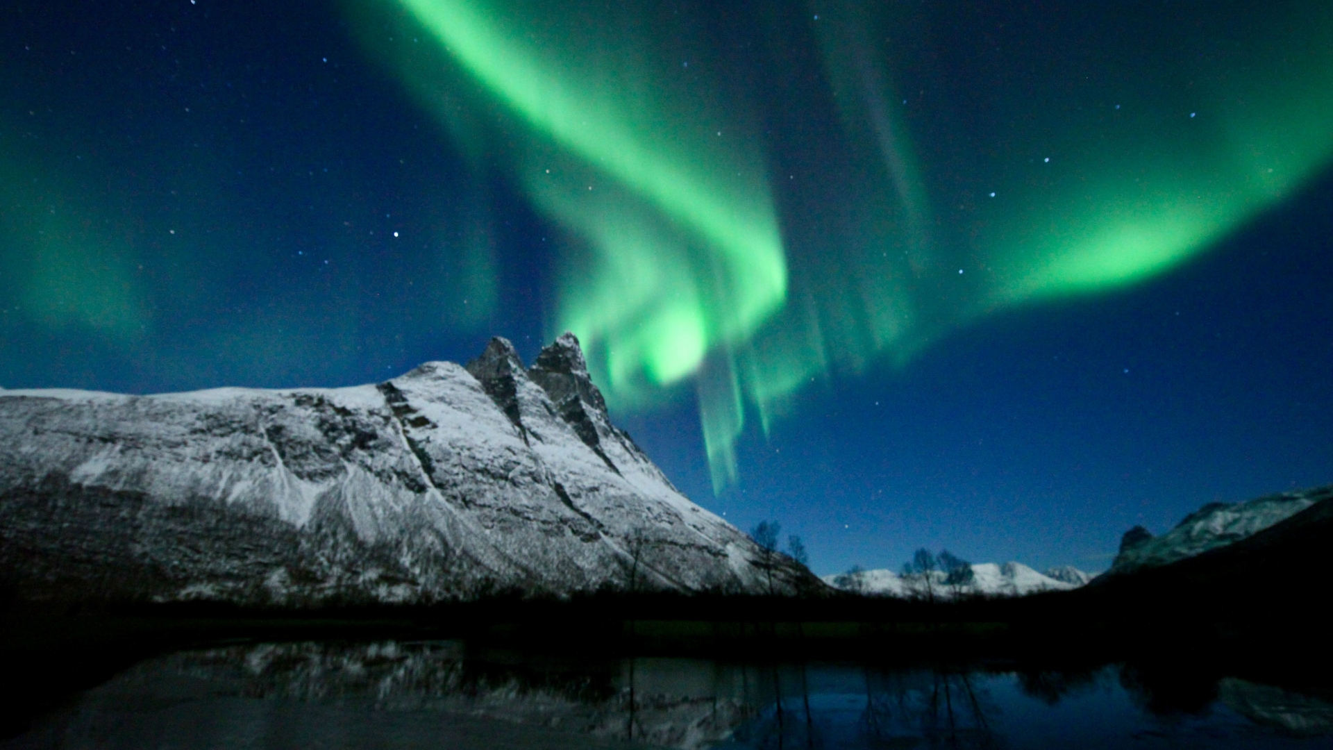 northern lights over a mountain
