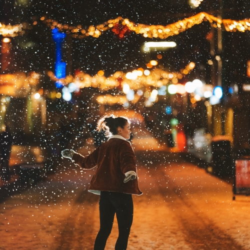 Girl enjoying the Christmas street in Tromsø