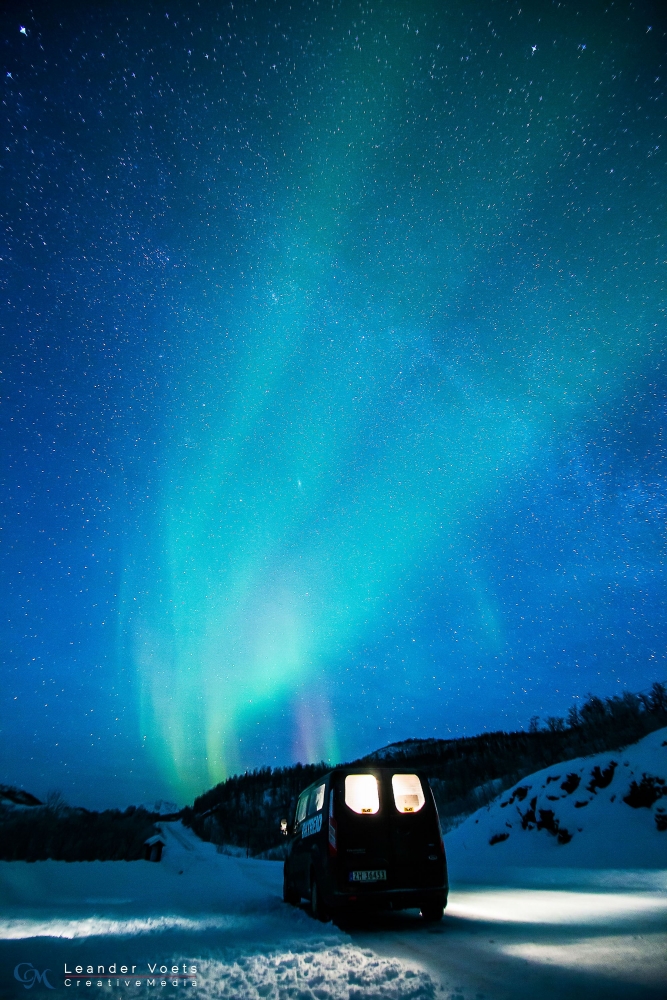 Northern lights and road