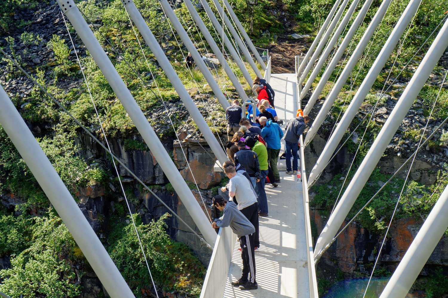 Visitors standing at the Gosha bridge enjoying the view