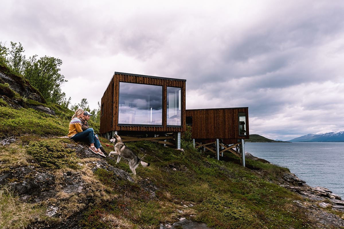 people sitting in front of Aurora Fjord Cabin