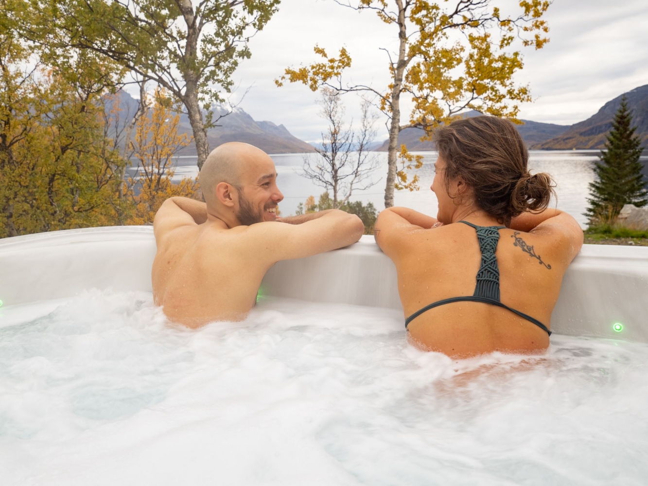 two people sitting in a jacuzzi