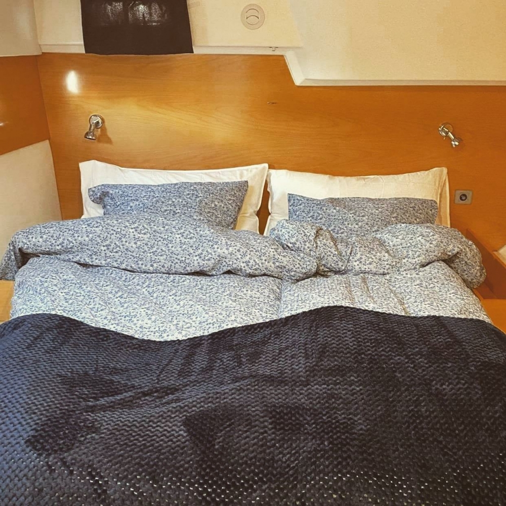 double bed in cabin on catamaran