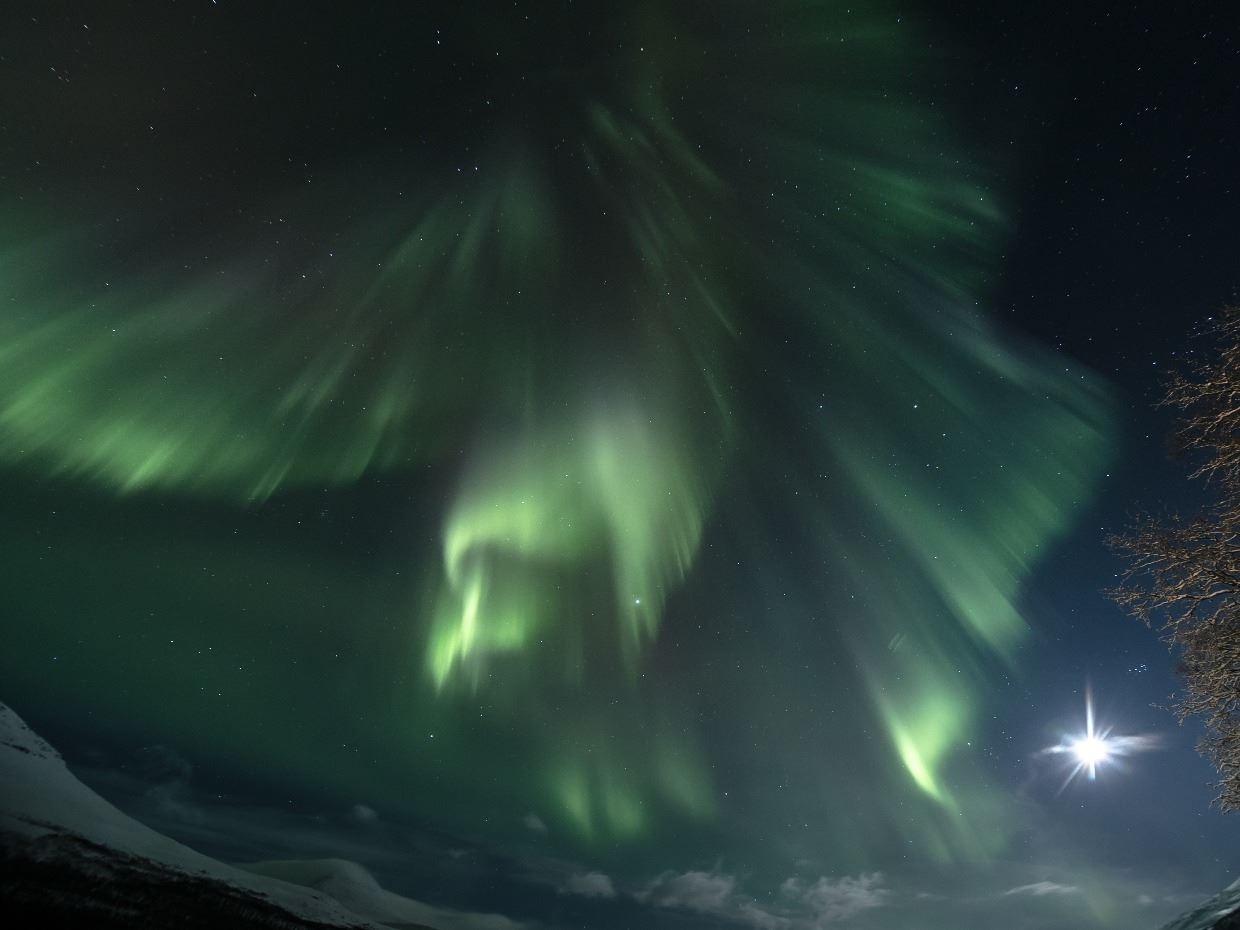 northern lights and full moon in the sky