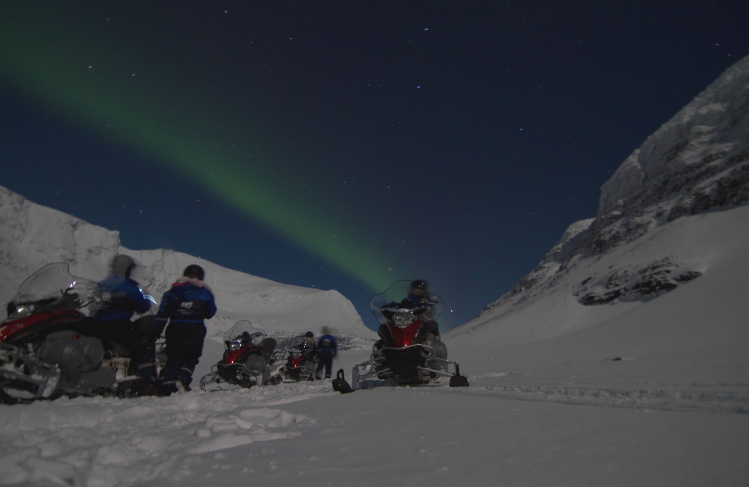 Snowmobile and northern lights