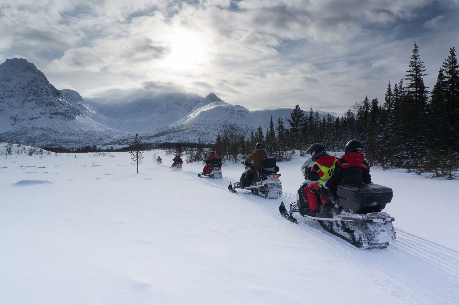 Snowmobile with the Lyngen alps in the background