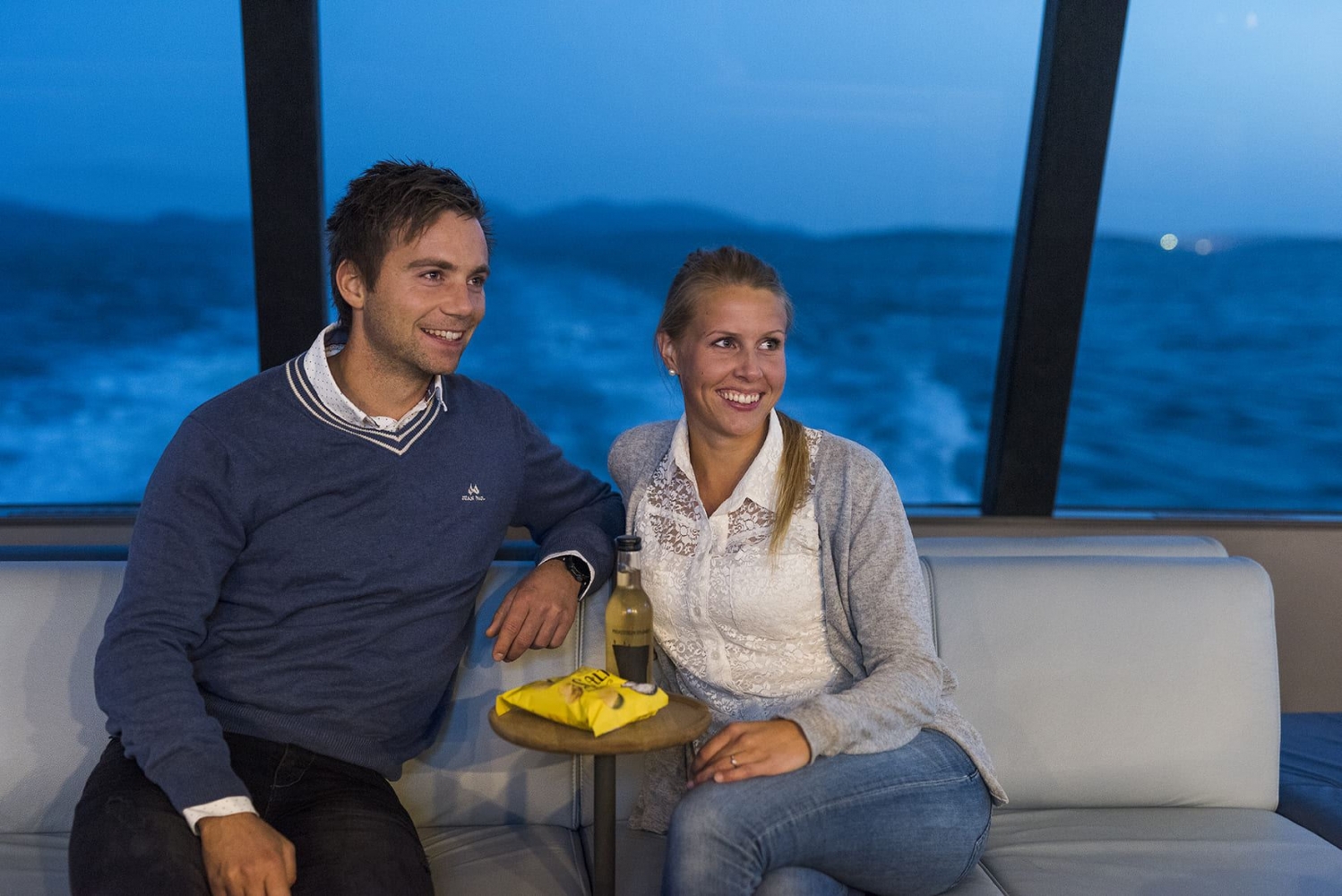 Man and woman inside of the catamaran