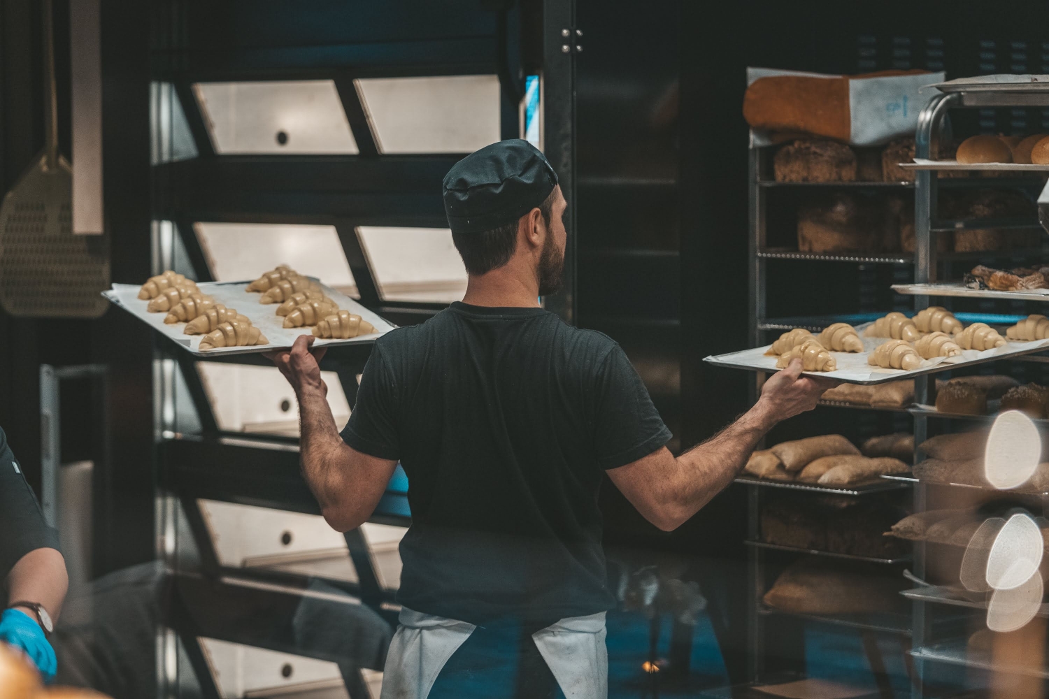 Baker working with baked goods