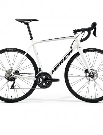 White racing bike with disk brakes.