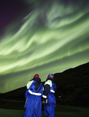 two people whatching the northern lights