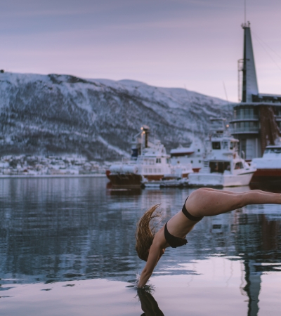 Girl diving in Tromsø