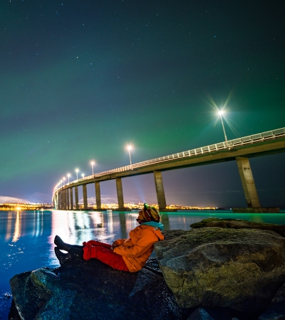 Woman watching the Northern Lights in Tromsø