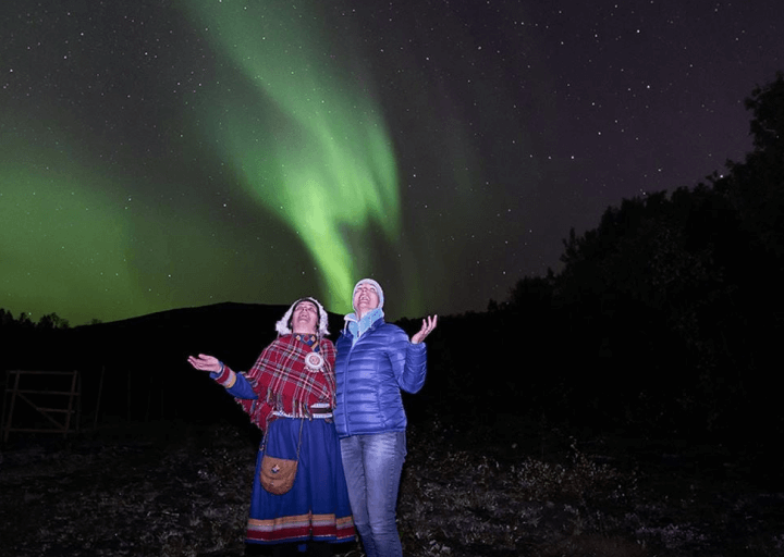 Admiring the northern lights at SamiCamp