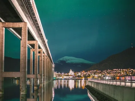 Northern lights above the Tromsø bridge and the Arctic Cathedral