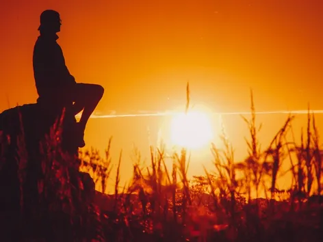 A man enjoying the midnight sun outdoors in the Tromsø region.