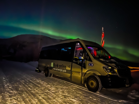 Picture of the minibus under the northern lights