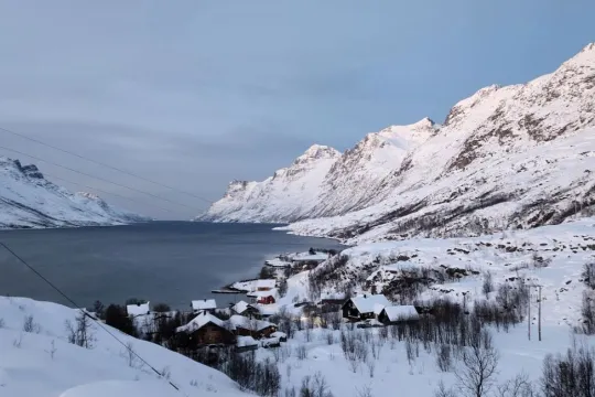 Snowcovered mountains and fjord view