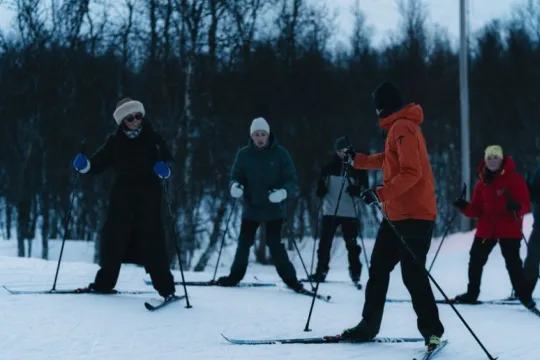Guests try the "fish legs" technique on skis
