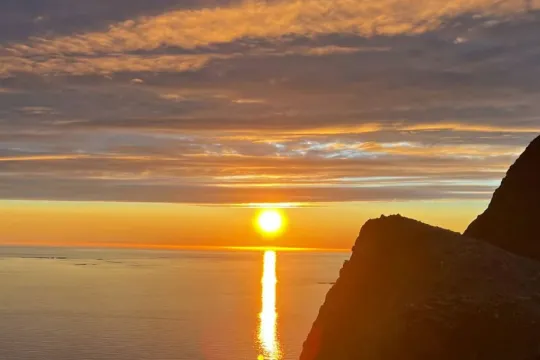 Midnight sun view from a mountain top