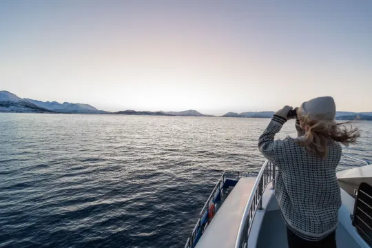 A person enjoying the view from the boat