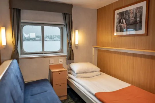The interior of a cabin with twin beds
