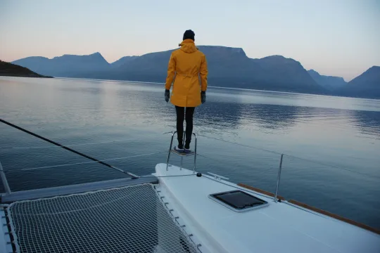 Guest looking out to sea from sailboat