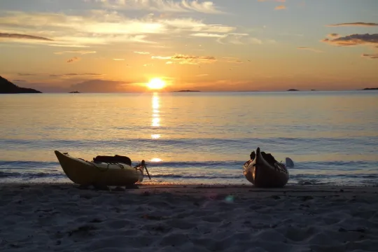 Two Kayak's on the beach looking out towards the sea