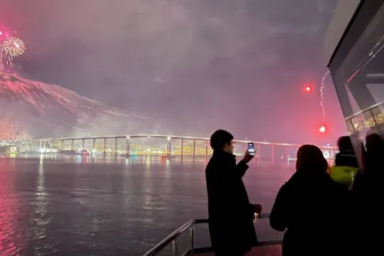 The Tromsø bridge and fireworks from th Cable Car