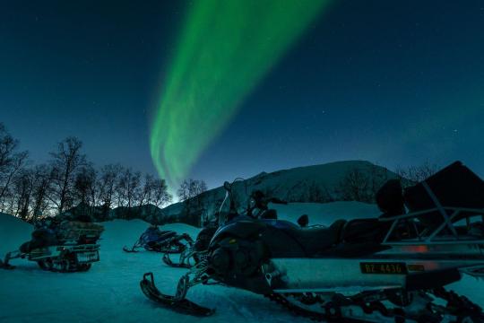 Snowmobile under the Northern Lights