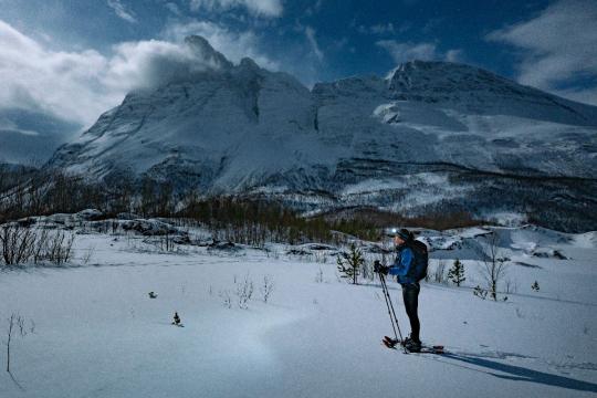 Snowshoeing in front of an mountain