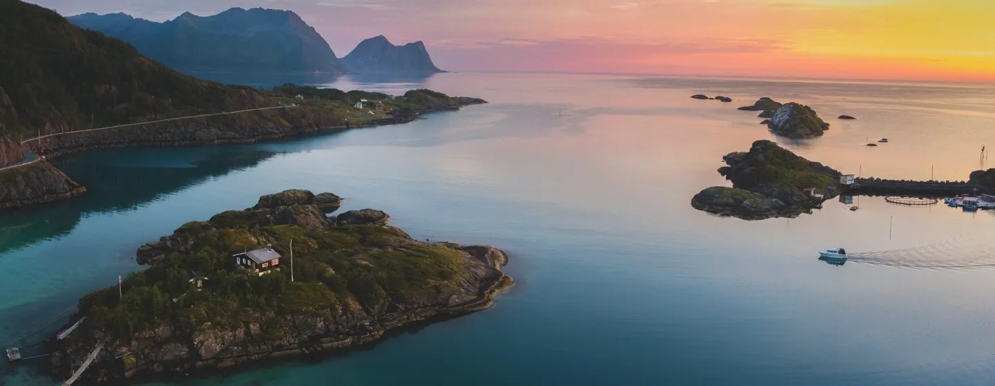View of islands and the sea with the sunset in the background