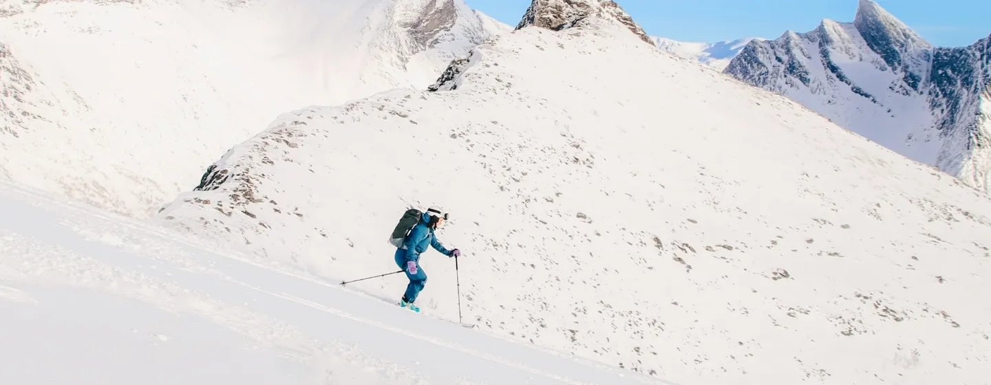 A lady ski touring in the Tromsø region