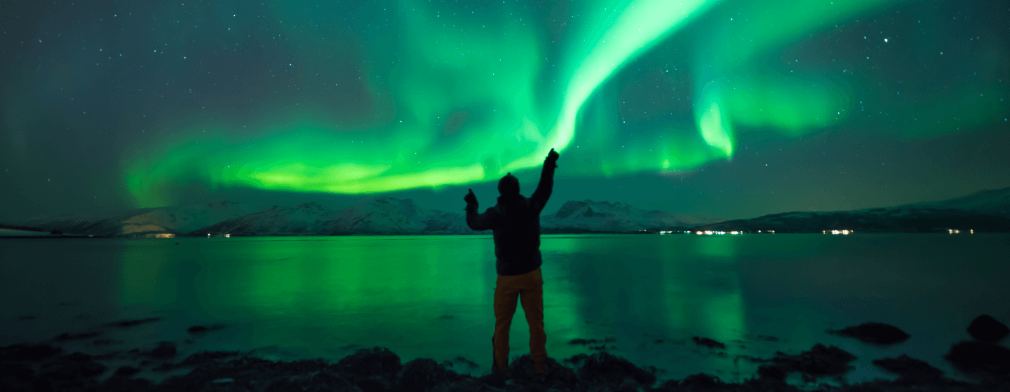 Man looking at the northern lights