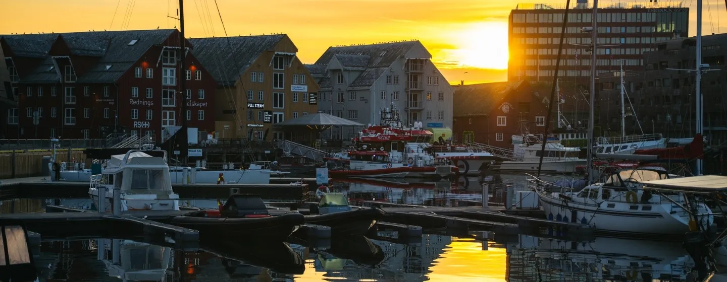 The Bangsund harbour in Tromsø and the midnight sun.