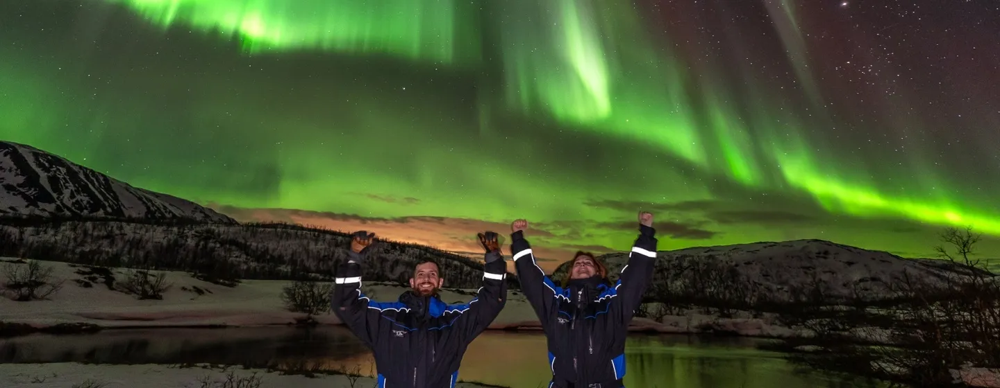 wo people under the Northern Lights
