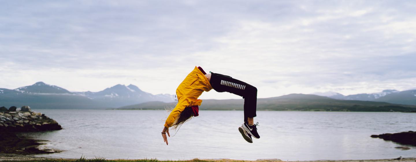 Girl doing gymnastics in Telegrafbukta in Tromsø