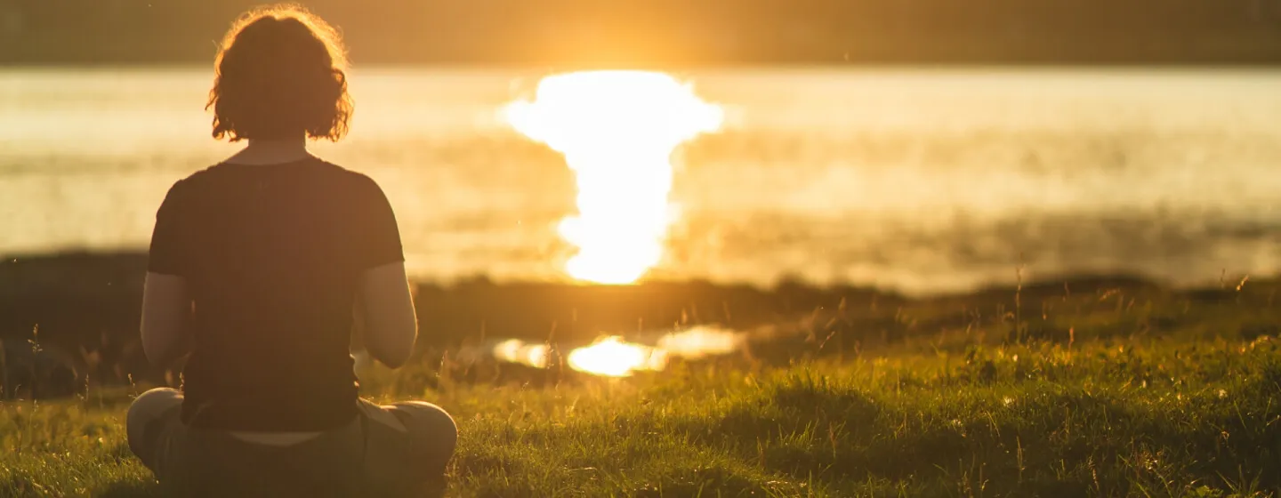 woman hiking on the mountain midnight sun